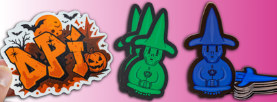 Halloween-themed DPI die cut sticker beside stacks of wizard stickers